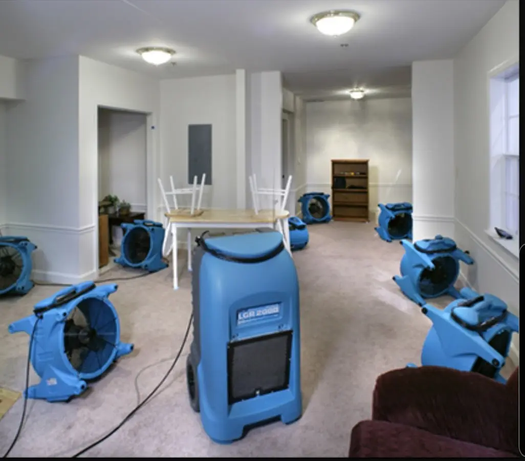 Air movers and dehumidifier setup for Water Damage Restoration in Thompson